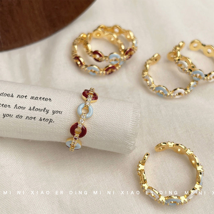 Gold Tone Chain Link Open Rings With Blue And Red Oval Stones