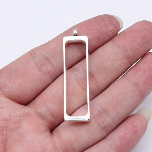 Narrow Rectangle Open Frame Pendants in Silver and Gold shown in image 1, highlighting a narrow open rectangle, rounded 
