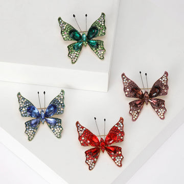 Crystal Butterfly Brooch with Polished Metal and Decorative Accents