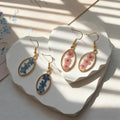 Oval Gold Frame Dried Flower Resin Drop Earrings Pink Blue view 3