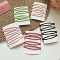 Glossy Enamel Openwork Oval Snap Hair Clips 4-Pack Black view 2