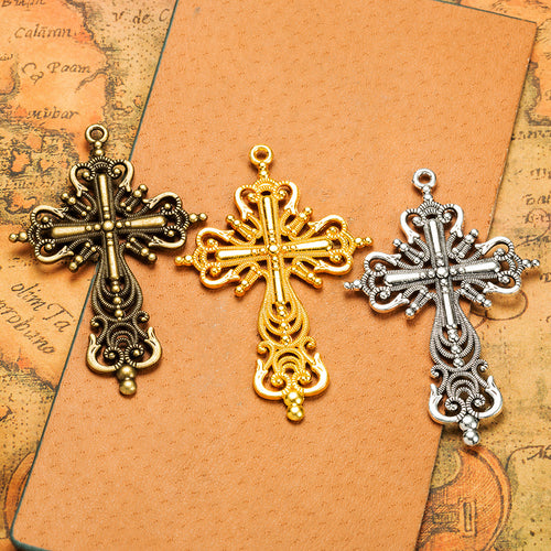 Ornate Openwork Cross Metal Charm shown in grouped finish view