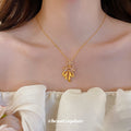 Gold Tone Bow And Flower Pendant Necklace With Teardrop Charms view 2