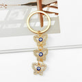 Gold Rhinestone Evil Eye Keychain With Butterfly And Hamsa Charm view 8
