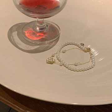 White Double Row Pearl Like Bracelet With Fine Chain And Flower Charm