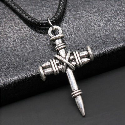 Hand held view of cross pendant necklaces