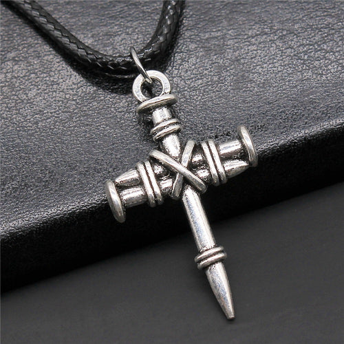 Hand held view of cross pendant necklaces