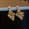 Gold Tone Filigree Leaf Cluster Drop Earrings With Polished Metal Tone Details view 6