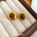 Gold Tone Rounded Square Stud Earrings with Brown Centers view 4