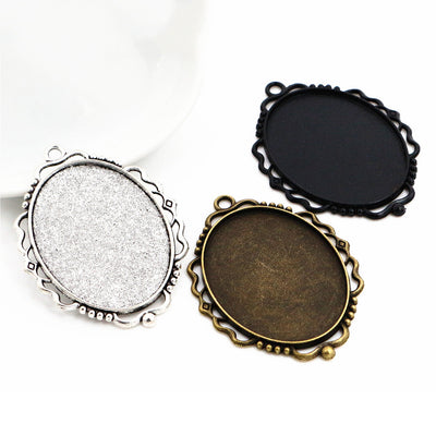scalloped oval cabochon pendant trays arranged together on a white background