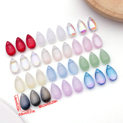 Front product photo of medium translucent teardrop glass bead showing the pictured design arrangement