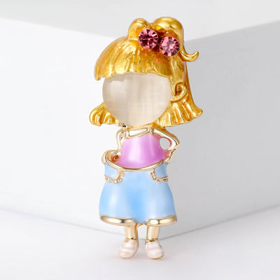 Front view of small girl figure with a round pearl-like face, blue skirt, and pink bow