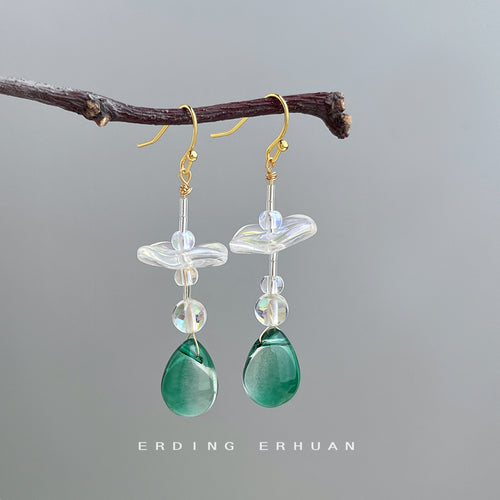 Gold-tone clear-flower green-teardrop long hooks in the first product display.