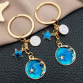 Six Blue Zodiac Moon and Star Metal Keychain Designs view 4