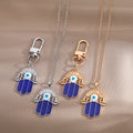 Gold and Silver Tone Open Hamsa Necklaces and Clip Keychains view 1
