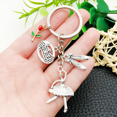 Overview showing the available color and design variations of the antique silver ballet dancer and slippers metal keycha