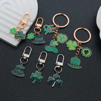 Overview showing the available color and design variations of the green clover and hat metal keychain design