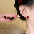 Small Flocked Horse Stud Earrings In Black And Burgundy view 4