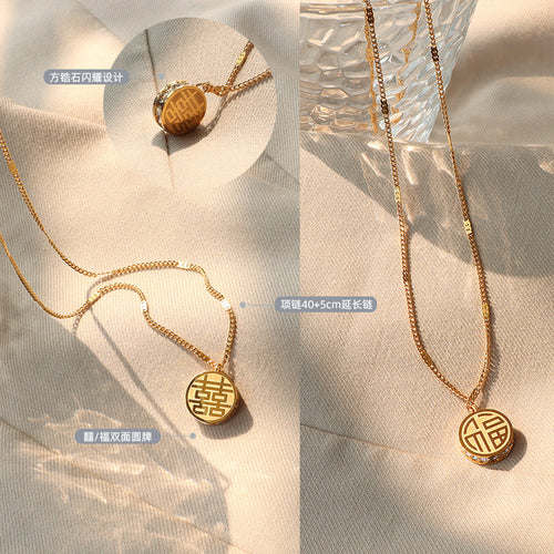 Gold 囍福 double-sided coin necklace flat lay with zircon edge labels