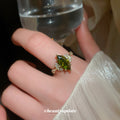 Gold Tone Olive Green Marquise Crystal Ring With Fan Side Clusters view 3