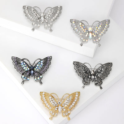 Open-wing butterfly set with clear or iridescent stones brooch front view