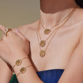 Crystal Rimmed Tree of Life Necklace and Bracelet in Gold Tone view 1