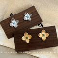 Silver Brushed Flower Stud Earrings Blue Center Stone view 1