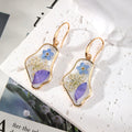 Gold Tone Blue Pressed Flower Resin Hook Earrings in Six Designs view 3