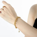 Gold Tone Curb Bracelet With Ball Bead Dangles Lobster Clasp view 1