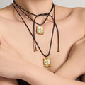 Long Black Cord Necklace with Green Floral Frame Pendant view 2