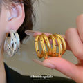 Triple Layer Curved Hoop Earrings in Gold Tone Statement Jewelry view 1