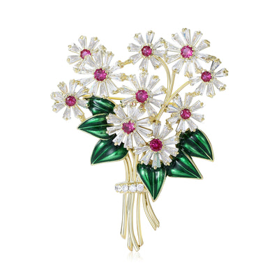 Gold daisy bouquet brooch with pink centers and green leaves