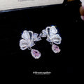 Silver Butterfly Pink Teardrop Stud Earrings with Polished Metal Details view 3