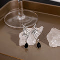 Silver Winged Bat and Black Teardrop Stud Earrings view 2