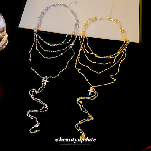 Snake Cross Necklace displayed as a pair