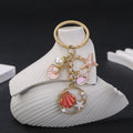 Four Pink and Blue Ocean Pearl-Look Metal Keychain Designs view 1