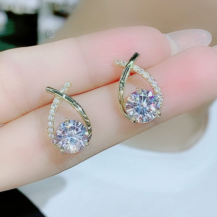 Gold Tone Crisscross Drop Earrings With Clear Round Stones