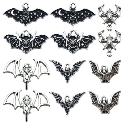 Metallic bat charms arranged on a light background
