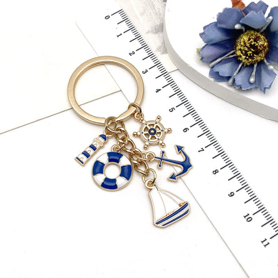 Overview showing the available color and design variations of the blue nautical lifebuoy anchor and sailboat keychain