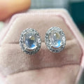 Silver Tone Oval Moonstone Look Halo Stud Earrings view 3