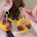 Resin Circle and Teardrop Earrings in Warm Yellow Tones view 3