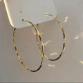 Large Slim Textured Hoop Earrings in Gold and Silver Tones view 6