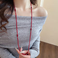 Layered Red Beaded Necklace with Knotted Strands and Gold Tone Accents view 3