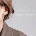 Antique Gold Textured Flower Stud Earrings Pearl Centers view 2
