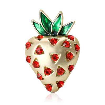 Front view of heart-shaped strawberry dotted with red stones beneath green leaves