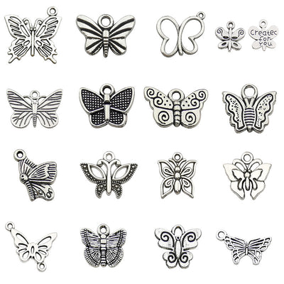 Metallic butterfly charms arranged on a light background