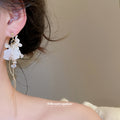 White Flower Pearl Tassel Earrings With Gold-Tone Settings view 3