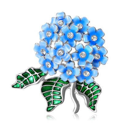 Front view of rounded hydrangea bloom above green leaves and a curved stem