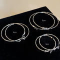 Twisted Silver Hoop Earrings in Three Sizes with Reflective Details view 2