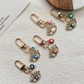 Gold Tone Rhinestone Lash Evil Eye Clip Charms in Five Colors view 1